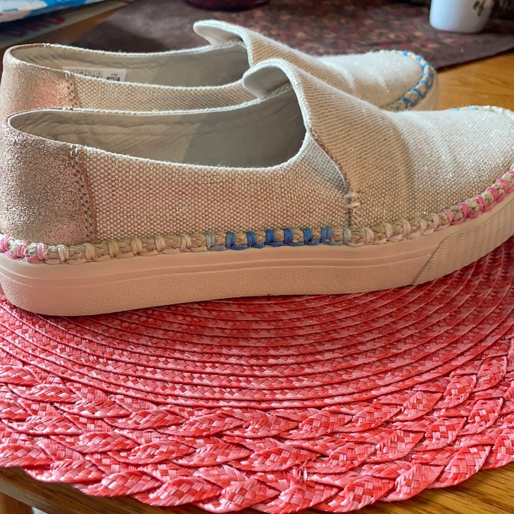 Toms cream shoes. pink, blue & white stitching.